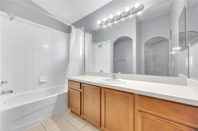 bathroom with tile patterned flooring, shower / tub combo, and vanity