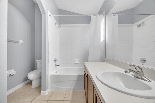 full bathroom with tile patterned floors, toilet, vanity, shower / tub combo, and baseboards