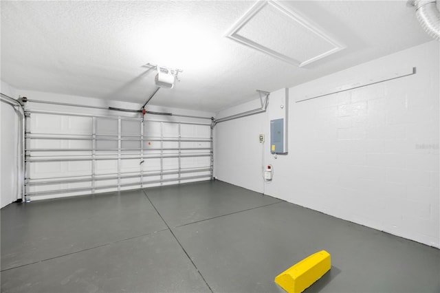 garage with electric panel, a garage door opener, and concrete block wall