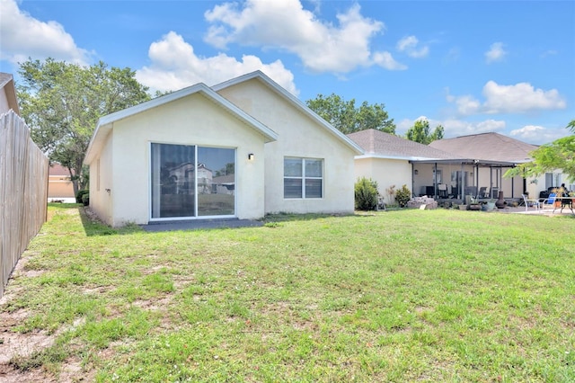 rear view of property with stucco siding