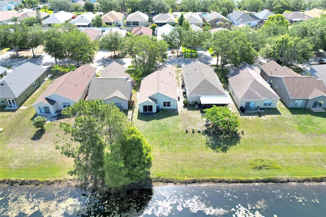 aerial perspective of suburban area with a large body of water