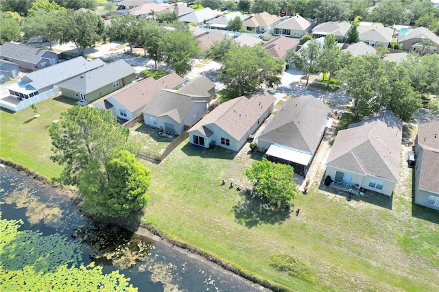 aerial perspective of suburban area with a large body of water