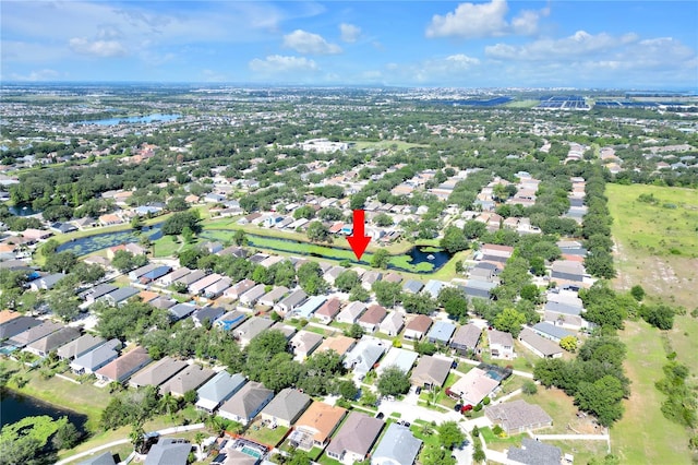 view of property location with nearby suburban area and a large body of water