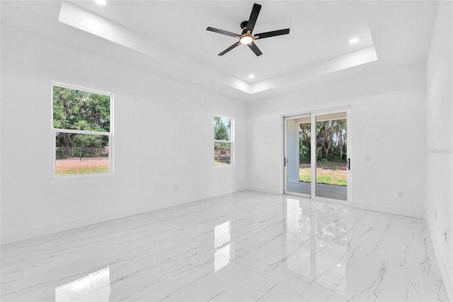 11921 Fort King Hwy, Thonotosassa, FL 33592 - unfurnished room with a raised ceiling, healthy amount of natural light, baseboards, recessed lighting, and a ceiling fan