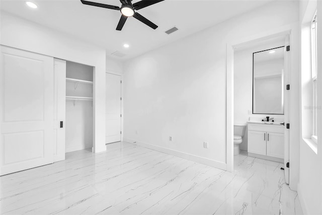 11921 Fort King Hwy, Thonotosassa, FL 33592 - unfurnished bedroom with light marble finish floors, recessed lighting, baseboards, connected bathroom, and a closet