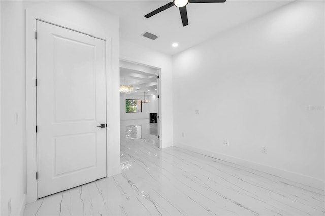 11921 Fort King Hwy, Thonotosassa, FL 33592 - spare room featuring ceiling fan, light marble finish floors, and baseboards