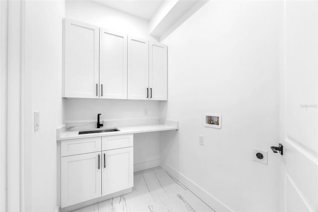 11921 Fort King Hwy, Thonotosassa, FL 33592 - washroom with hookup for an electric dryer, cabinet space, washer hookup, light marble finish flooring, and baseboards