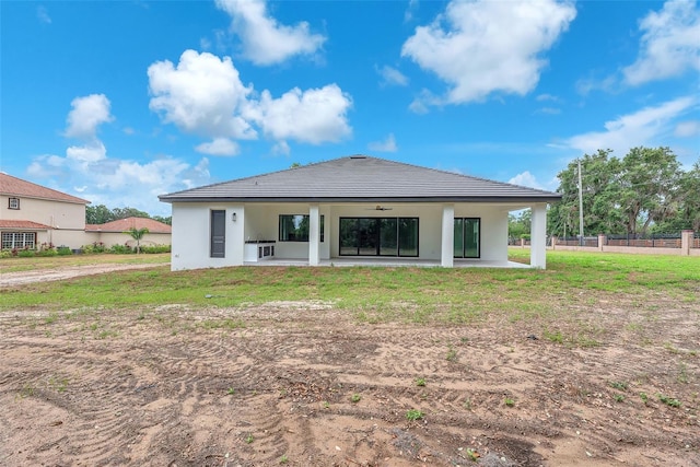 11921 Fort King Hwy, Thonotosassa, FL 33592 - rear view of house featuring a patio area, a tile roof, stucco siding, and ceiling fan