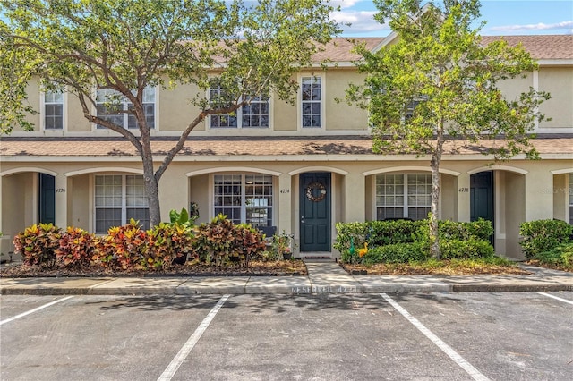 4734 67th Ave N, Pinellas Park, FL 33781 - view of property featuring uncovered parking and stucco siding