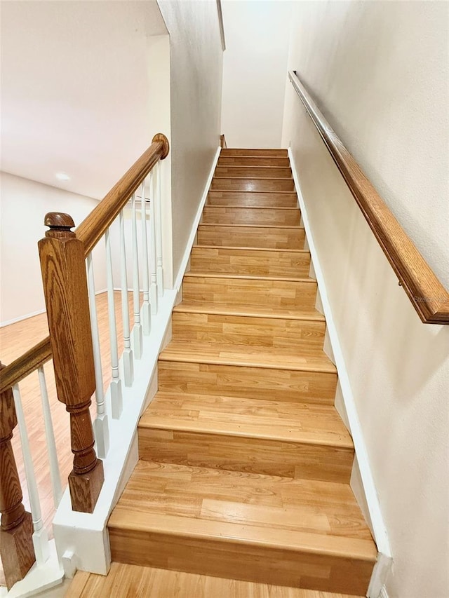 15922 Fishhawk Creek Ln, Lithia, FL 33547 - stairway featuring wood finished floors and baseboards