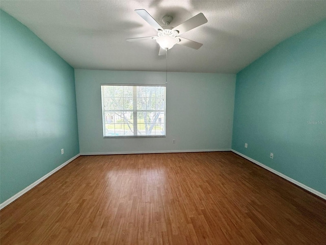 15922 Fishhawk Creek Ln, Lithia, FL 33547 - empty room featuring wood finished floors, baseboards, and ceiling fan