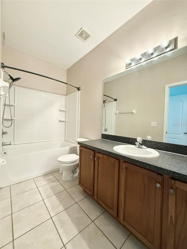 15922 Fishhawk Creek Ln, Lithia, FL 33547 - full bathroom featuring tile patterned floors, vanity, toilet, tub / shower combination, and a textured ceiling
