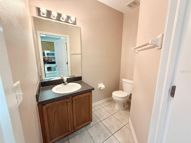 15922 Fishhawk Creek Ln, Lithia, FL 33547 - bathroom featuring tile patterned flooring, toilet, vanity, and baseboards