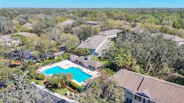 15922 Fishhawk Creek Ln, Lithia, FL 33547 - drone / aerial view of a pool area and a heavily wooded area