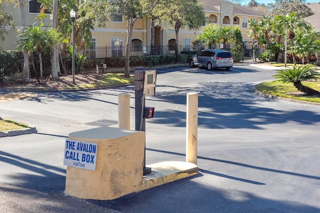 1230 S Missouri Ave Unit 704, Clearwater, FL 33756 - view of asphalt street featuring curbs, street lights, and a gate
