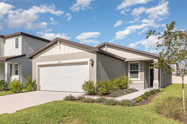 7119 Amelia River Dr, Parrish, FL 34219 - view of front of property featuring board and batten siding, a garage, driveway, and a front yard
