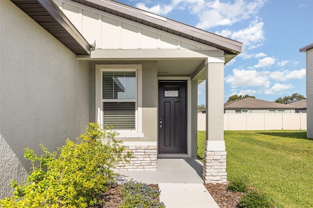 7119 Amelia River Dr, Parrish, FL 34219 - view of exterior entry featuring stucco siding and stone siding