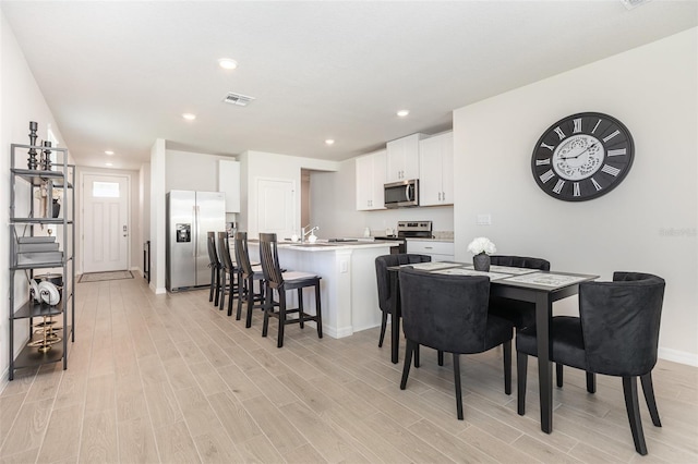 7119 Amelia River Dr, Parrish, FL 34219 - dining space with light wood-type flooring, baseboards, and recessed lighting