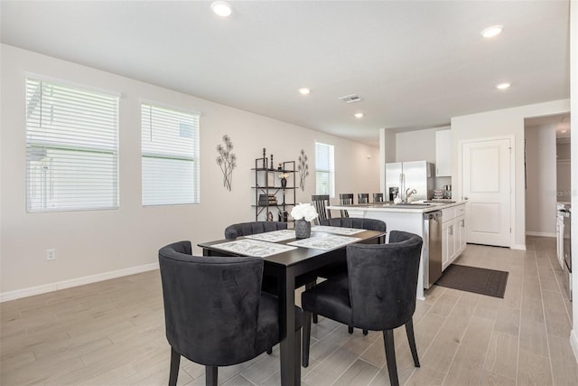 7119 Amelia River Dr, Parrish, FL 34219 - dining area featuring light wood-style flooring, baseboards, and recessed lighting