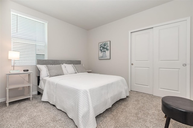 7119 Amelia River Dr, Parrish, FL 34219 - bedroom with light colored carpet, a closet, and baseboards
