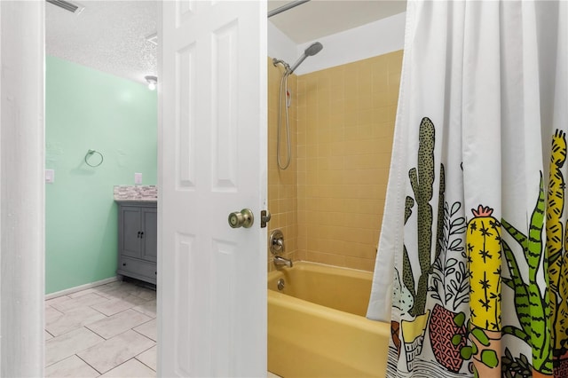 2646 61st Ave N, Saint Petersburg, FL 33714 - full bath featuring shower / bath combination with curtain, vanity, tile patterned flooring, and baseboards