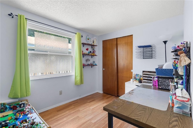 2646 61st Ave N, Saint Petersburg, FL 33714 - office with light wood finished floors, a textured ceiling, and baseboards