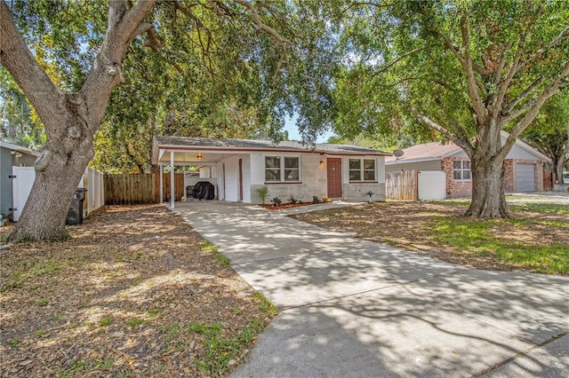 2646 61st Ave N, Saint Petersburg, FL 33714 - ranch-style home featuring a carport and concrete driveway