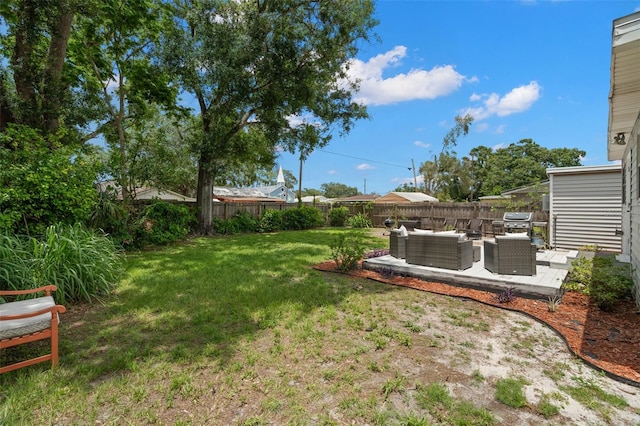 1003 W Indiana Ave, Tampa, FL 33603 - fenced backyard featuring outdoor lounge area and a patio