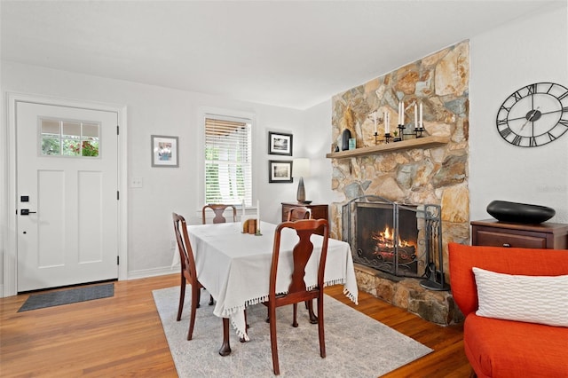 1003 W Indiana Ave, Tampa, FL 33603 - dining area with wood finished floors and a fireplace