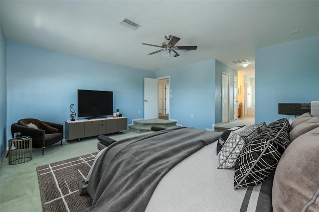 7852 Stoney Hill Dr, Wesley Chapel, FL 33545 - carpeted bedroom with ceiling fan, baseboards, and ensuite bathroom