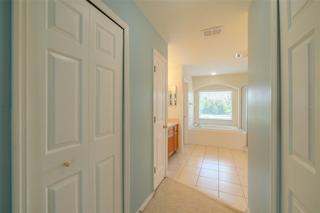 7852 Stoney Hill Dr, Wesley Chapel, FL 33545 - hall with light tile patterned floors