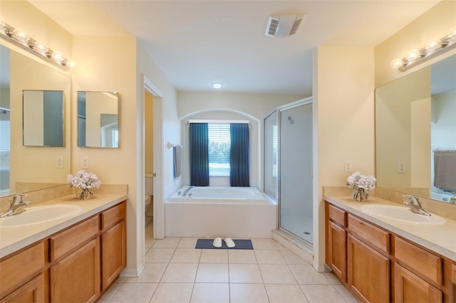 7852 Stoney Hill Dr, Wesley Chapel, FL 33545 - full bathroom with two vanities, a bath, and a shower stall