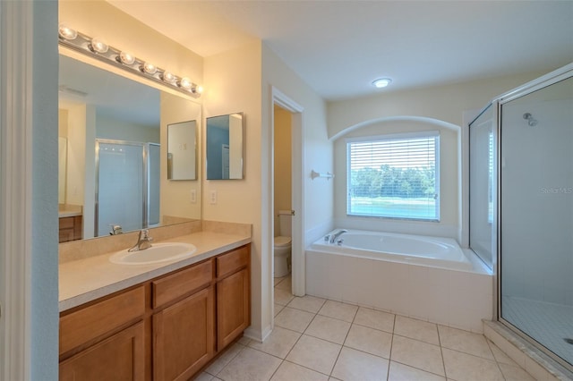7852 Stoney Hill Dr, Wesley Chapel, FL 33545 - full bathroom featuring toilet, a shower stall, vanity, and tile patterned flooring