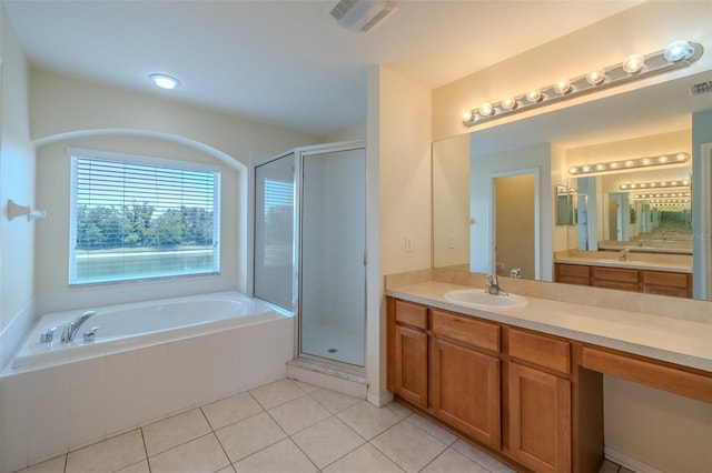 7852 Stoney Hill Dr, Wesley Chapel, FL 33545 - bathroom with a bath, vanity, a shower stall, and tile patterned flooring