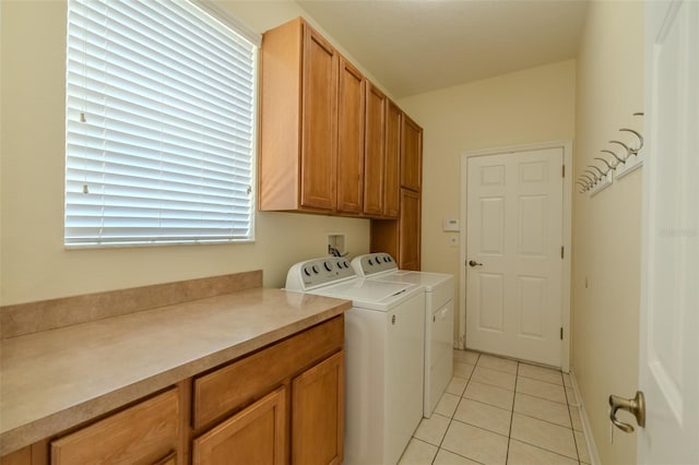 7852 Stoney Hill Dr, Wesley Chapel, FL 33545 - washroom featuring cabinet space, separate washer and dryer, and light tile patterned floors