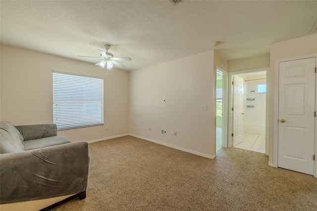 7852 Stoney Hill Dr, Wesley Chapel, FL 33545 - living area featuring carpet floors, ceiling fan, and plenty of natural light