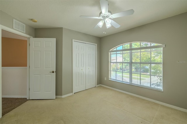 7852 Stoney Hill Dr, Wesley Chapel, FL 33545 - unfurnished bedroom featuring carpet floors, a closet, baseboards, and ceiling fan