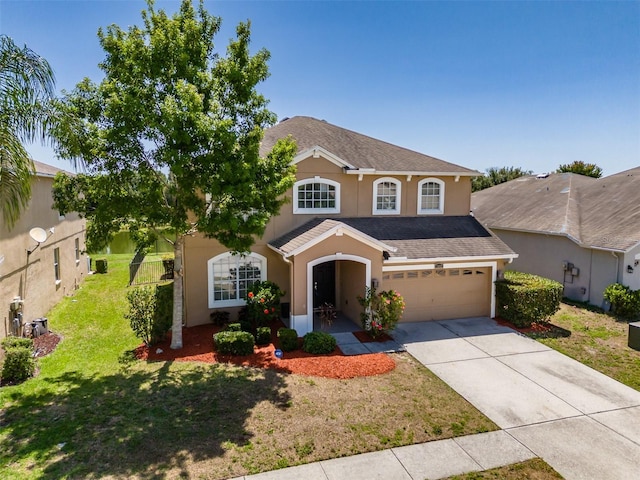 7852 Stoney Hill Dr, Wesley Chapel, FL 33545 - traditional-style home with concrete driveway, a garage, stucco siding, and a front lawn