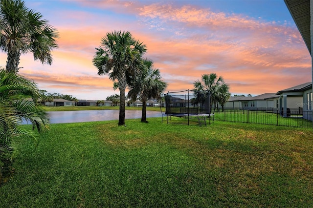 8496 Starlight Loop, Parrish, FL 34219 - yard at dusk featuring a water view and a trampoline
