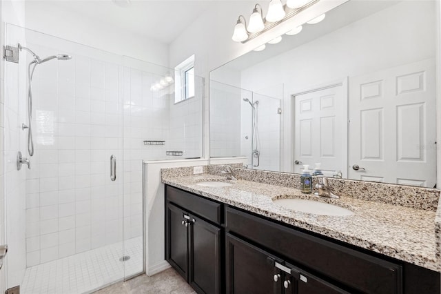 8496 Starlight Loop, Parrish, FL 34219 - bathroom with a stall shower, double vanity, and tile patterned floors