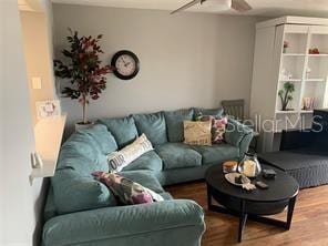 51 Island Way Unit 309, Clearwater Beach, FL 33767 - living area with a ceiling fan and wood finished floors