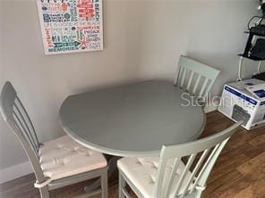 51 Island Way Unit 309, Clearwater Beach, FL 33767 - dining space featuring wood finished floors