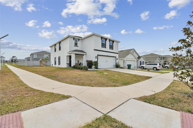 view of front of property featuring a garage, driveway, stucco siding, and a residential view