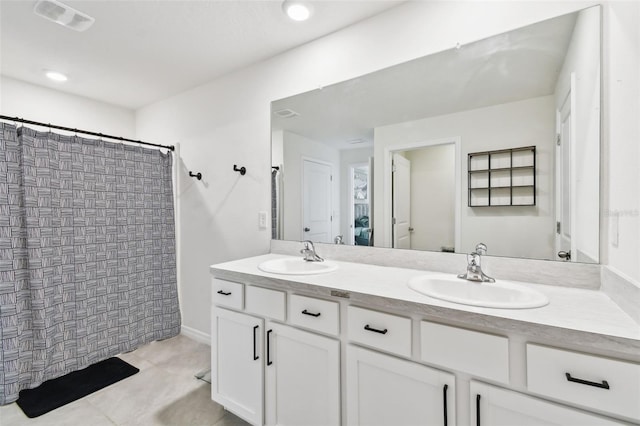 full bathroom with double vanity, tile patterned floors, and curtained shower
