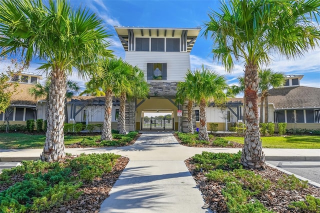 view of property with curved driveway