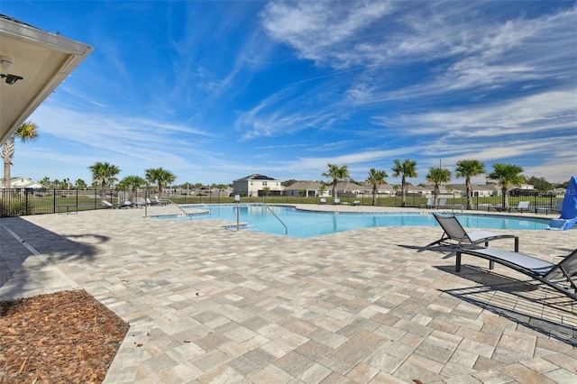 community pool featuring a patio area