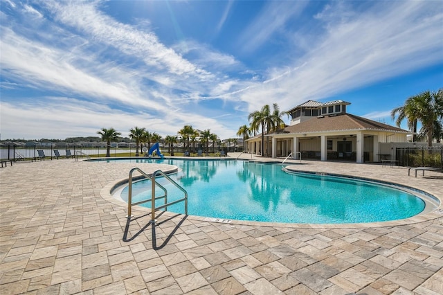 community pool with a patio area