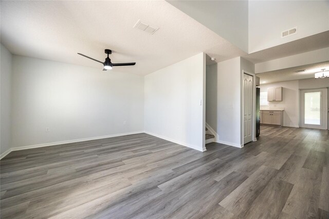 14384 NW 160th Ln, Alachua, FL 32615 - empty room featuring ceiling fan, dark wood-type flooring, and baseboards