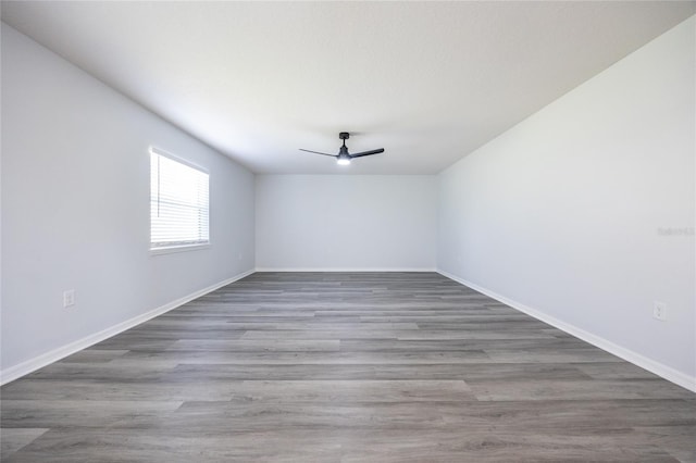 14384 NW 160th Ln, Alachua, FL 32615 - spare room with ceiling fan, baseboards, and wood finished floors