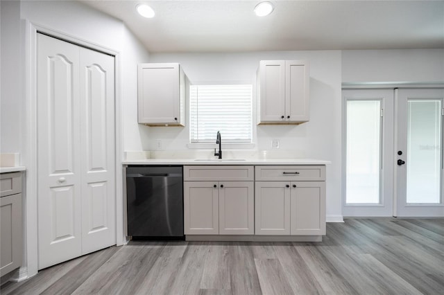 14384 NW 160th Ln, Alachua, FL 32615 - kitchen with a sink, dishwasher, light wood-style floors, light countertops, and recessed lighting